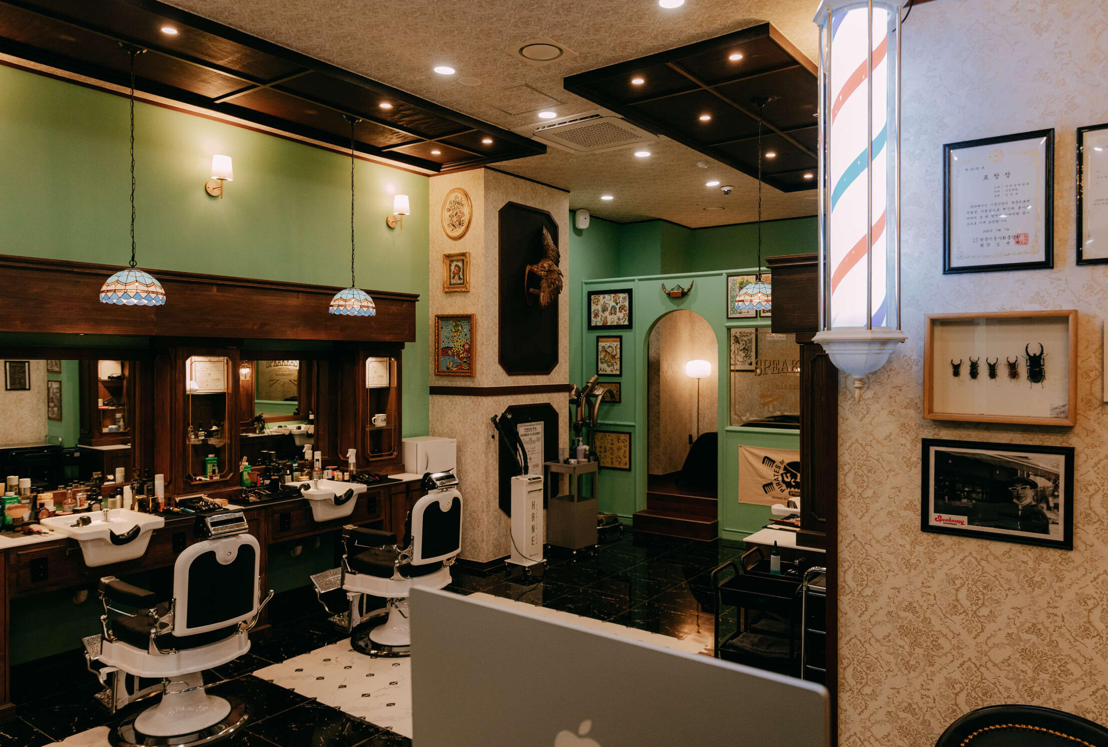 Vintage-inspired interior of Speakeasy Barbershop in Gangnam, Seoul with classic barber chairs and decor